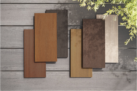 Six decking samples of colors ranging from light tan to dark brown are shown atop a TimberTech deck