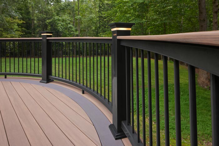 Classic Composite Series Drink Rail in Black with black aluminum balusters and an English Walnut deck board top rail