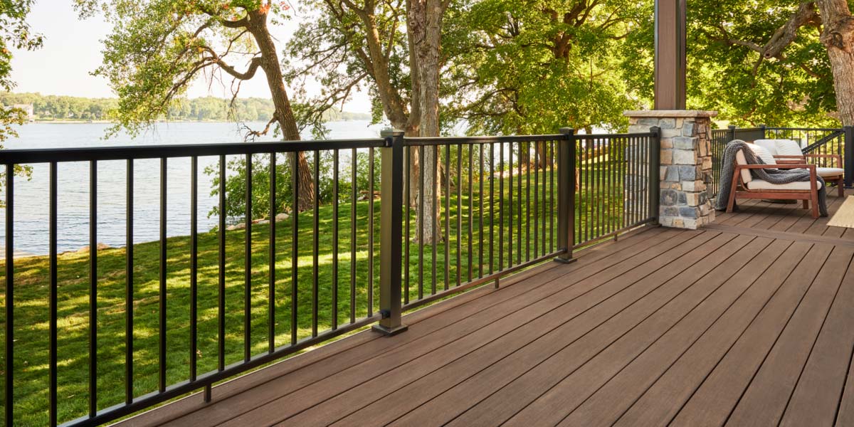 Impression Rail Express railing in black with aluminum balusters on deck of a lakefront property