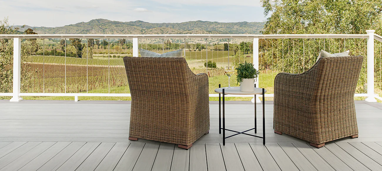 Gray pool deck with matching backboards and lounge chairs