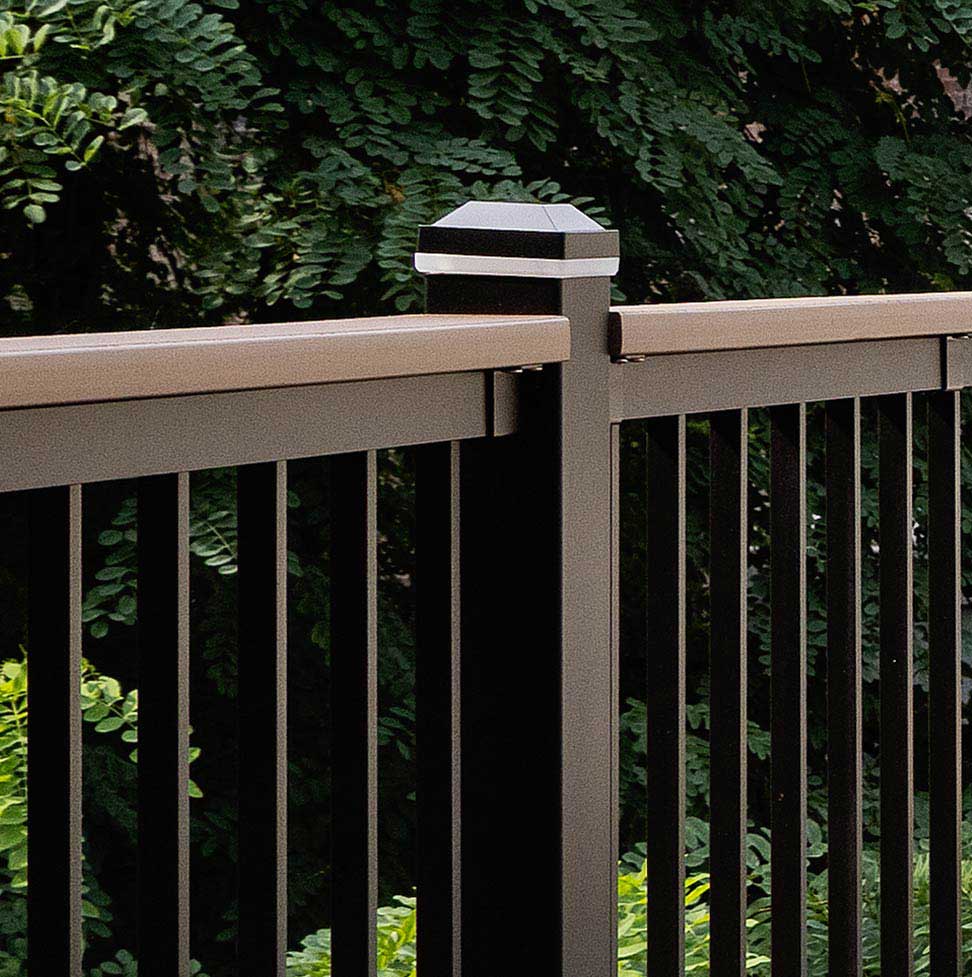 Impression Railing Express in Classic Black against a Dark Green background. 