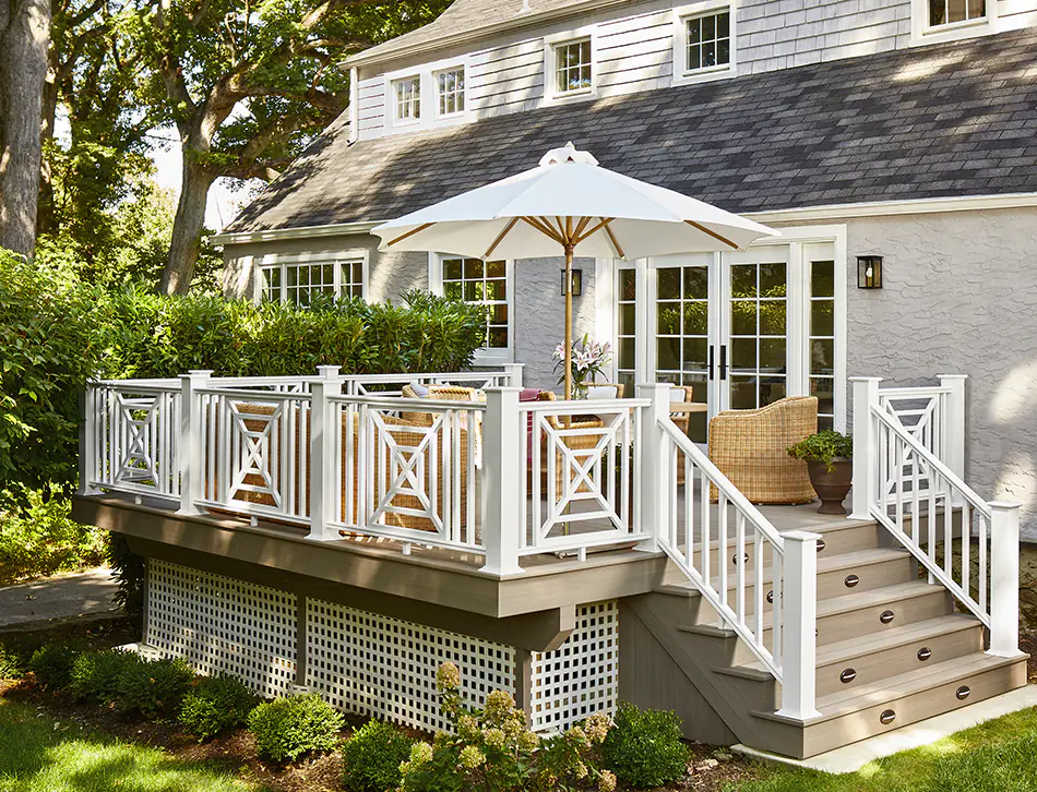 A deck with TimberTech railing and an elaborate chippendale infill